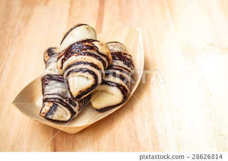 Fresh tasty croissants on wooden background. Fresh tasty croissants on wooden background. 28626814