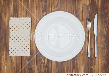 Knife, fork, napkin and dinner plate Knife, fork, napkin and dinner plate 28627284