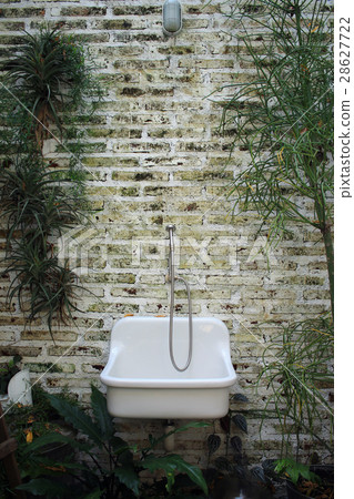 Old sink on brick background Old sink on brick background 28627722