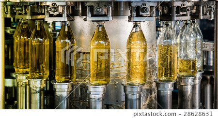 Filling bottles with juice 28628631