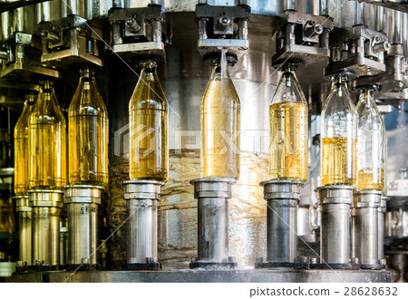 Filling bottles with juice 28628632