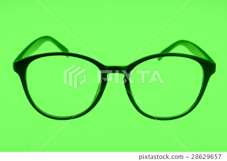 Eyeglasses isolated on green Eyeglasses isolated on green 28629657