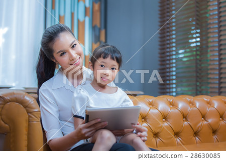 Mother and girl with tablet computer 28630085