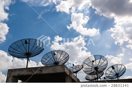 Satellite dishes that are several black Satellite dishes that are several black 28631141