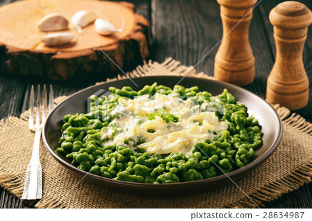 German dumplings (spaetzle) with spinach,cheese. German dumplings (spaetzle) with spinach,cheese. 28634987