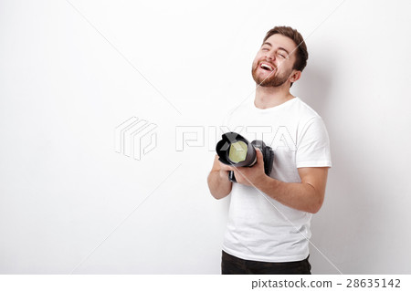 young smilling professional photographer in t 28635142