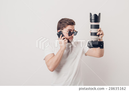 young professional photographer in white shirt young professional photographer in white shirt 28635162