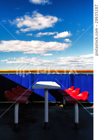 Red chairs on a blue background on the ferry 28635287