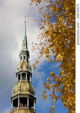 Steeple of St. Peter's Cathedral in Riga in autumn Steeple of St. Peter's Cathedral in Riga in autumn 28636871