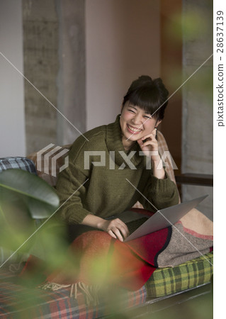 A woman relaxing in the room 28637139