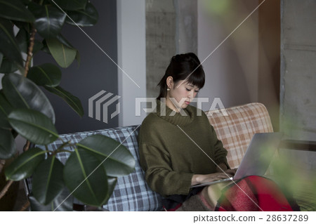 A woman relaxing in the room A woman relaxing in the room 28637289