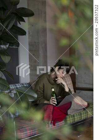A woman relaxing in the room 28637322