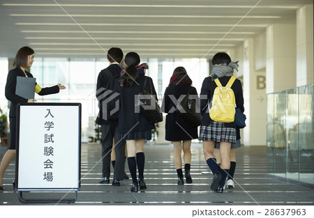 Examinees entering the examination site Examinees entering the examination site 28637963