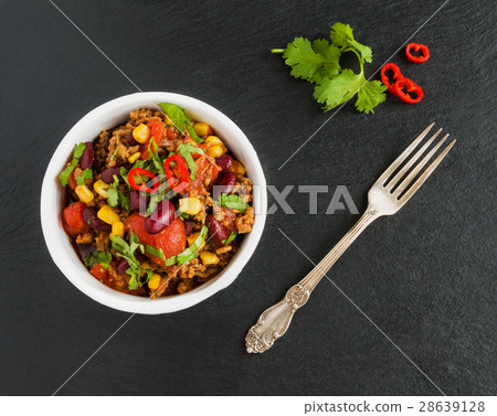 Chili con carne in a white ceramic bowl Chili con carne in a white ceramic bowl 28639128
