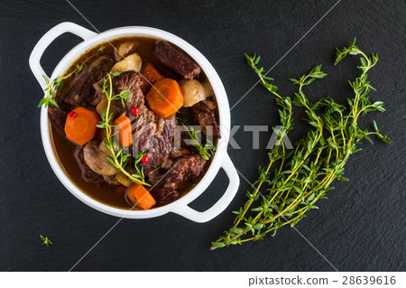 Beef Bourguignon in a white soup bowl Beef Bourguignon in a white soup bowl 28639616