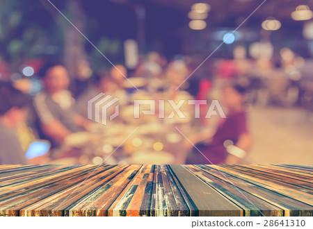 wood table and restaurant blur background. wood table and restaurant blur background. 28641310
