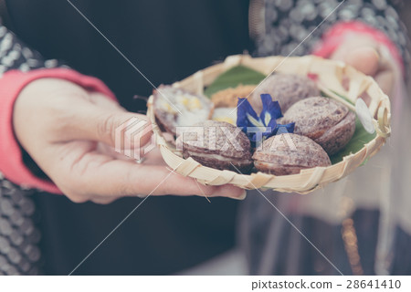 female asian hand hold Thai style Sweets. 28641410