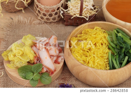Egg noodles with pork and dumpling in soup. Egg noodles with pork and dumpling in soup. 28642858