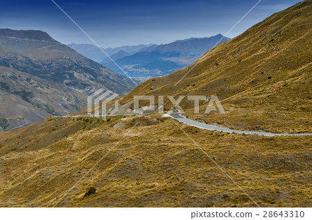 Road, mountains, and lake in New Zealand 28643310