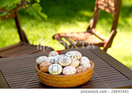 Easter Eggs On The Wooden Table In The Garden 28643481