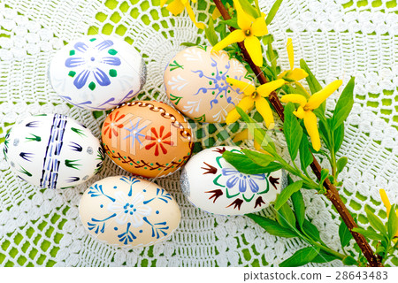 Easter Eggs And Yellow Blossom On The Tablecloth 28643483