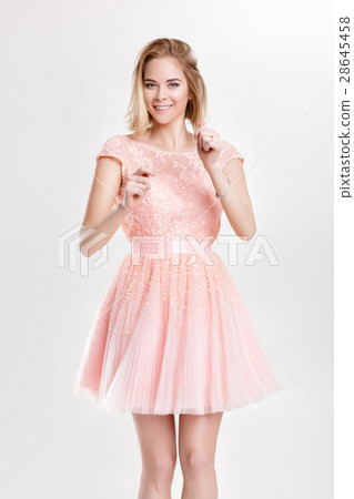 beautiful blond woman in a pink cocktail dress 28645458