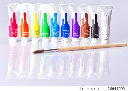 Brush tubes lies on the background with paints Brush tubes lies on the background with paints 28645903