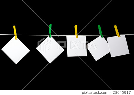 blank sheets of paper attached to a rope 28645917
