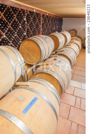 Wine Barrels and Bottles Age Inside Cellar Wine Barrels and Bottles Age Inside Cellar 28646233