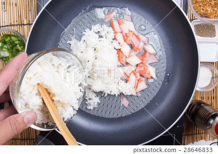 Chef put cooking rice to pan 28646833