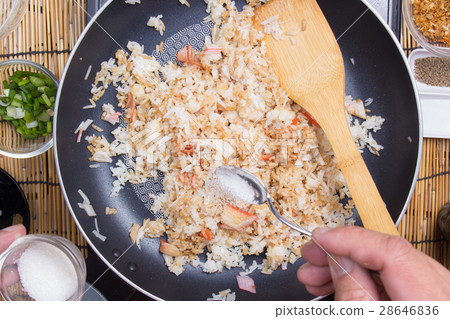 Chef putting sugar for cooking rice Chef putting sugar for cooking rice 28646836