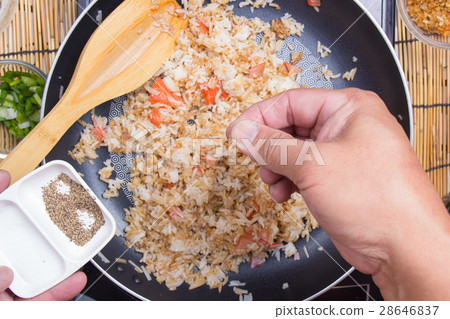 Chef putting pepper for cooking fried rice Chef putting pepper for cooking fried rice 28646837
