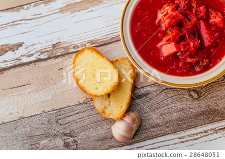 Ukrainian borsch soup with sour cream on a table 28648051