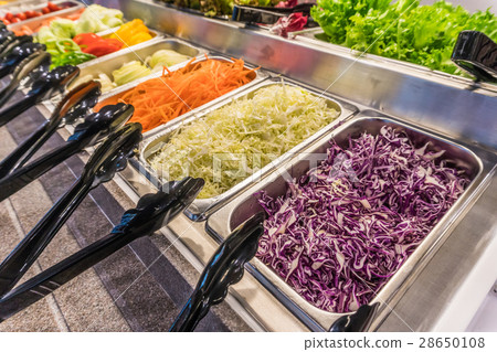 Salad bar with vegetables in silver trays Salad bar with vegetables in silver trays 28650108