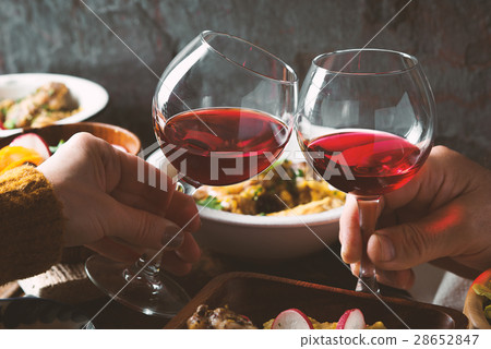 Glasses with a drink in his hand and a festive 28652847