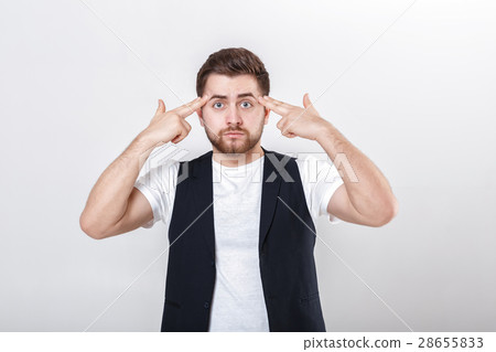 finger to his temple. young man with beard in 28655833