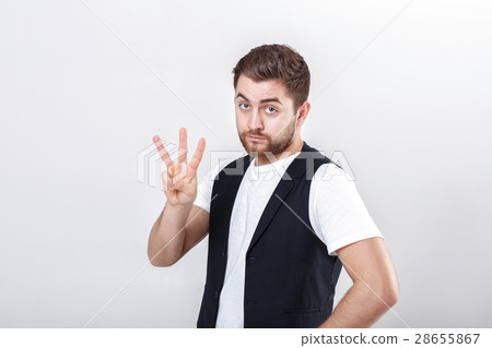 young man with a beard in white shirt and black young man with a beard in white shirt and black 28655867