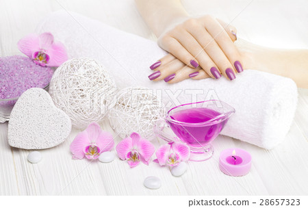 beautiful pink manicure with orchid and towel on beautiful pink manicure with orchid and towel on 28657323