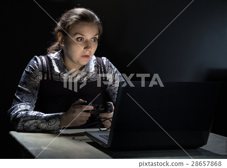Surprised woman playing video games 28657868