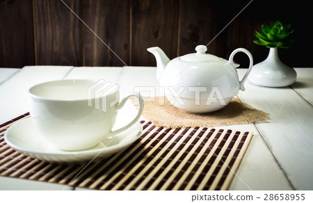 Beautiful set with tea on wooden table. Beautiful set with tea on wooden table. 28658955