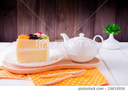 Fruit whipped cream cake and teapot. Fruit whipped cream cake and teapot. 28658956