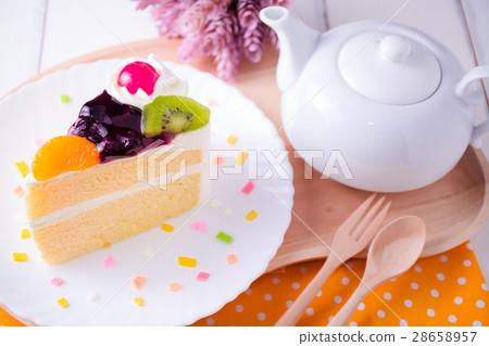 Fruit whipped cream cake and teapot. Fruit whipped cream cake and teapot. 28658957