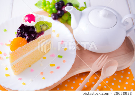 Fruit whipped cream cake and teapot. Fruit whipped cream cake and teapot. 28658958