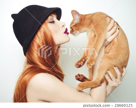 Beautiful lady with Abyssinian cat 28660125