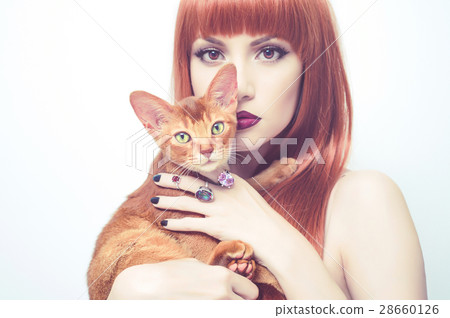 Beautiful lady with Abyssinian cat 28660126