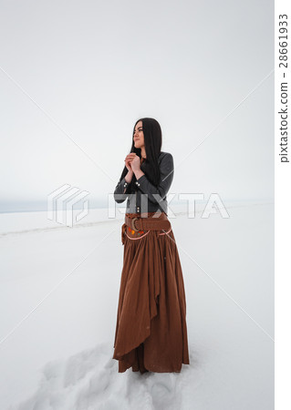 Girl in ethnic costume standing in a field, which Girl in ethnic costume standing in a field, which 28661933
