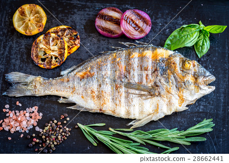 Grilled dorada fish fresh vegetables and herbs Grilled dorada fish fresh vegetables and herbs 28662441