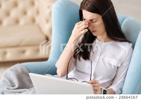 Unhappy tired woman having a headache Unhappy tired woman having a headache 28664167