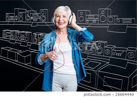 Happy senior woman visiting the appliance store 28664440