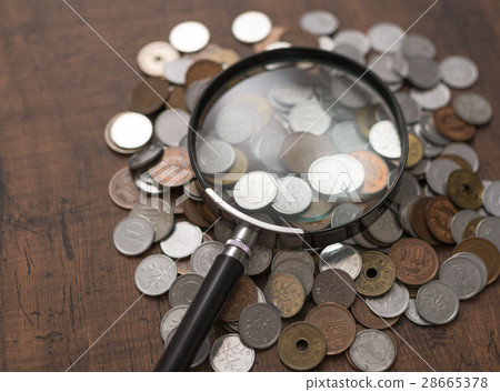 Money and magnifying glass 28665378